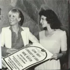Linda – Debbie Jackson – Concert of love sign Two women smile while holding a sign for a charity event featuring Wayne Newton. The event supports Opportunity Village, highlighting Linda Smith's dedication to nonprofit fundraising and advocacy.| Linda’s Life – Linda Smith