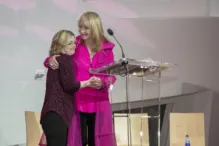 Linda Smith Unwanted 33 Linda Smith, a motivational speaker, warmly embraces a young woman with Down syndrome at a charity event, highlighting her advocacy and nonprofit leadership.| Linda’s Life – Linda Smith