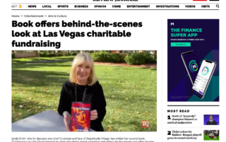 Linda Smith, a motivational speaker, holds her book "Confessions of a Sin City Fundraiser" while standing in a park, highlighting her work in nonprofit fundraising and philanthropy.| Linda’s Life – Linda Smith